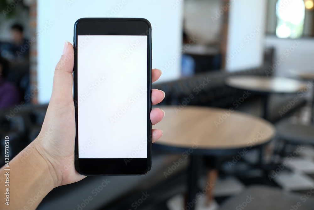 Close up of women's hands holding cell telephone blank copy space screen. smart phone with technology concept