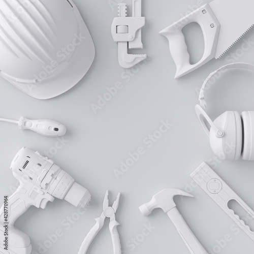 Top view of monochrome construction tools for repair and installation on white