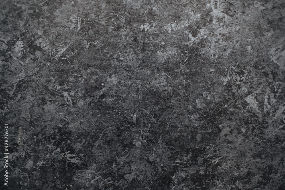 Naklejka premium Dark black stone wall background with textured surface.
