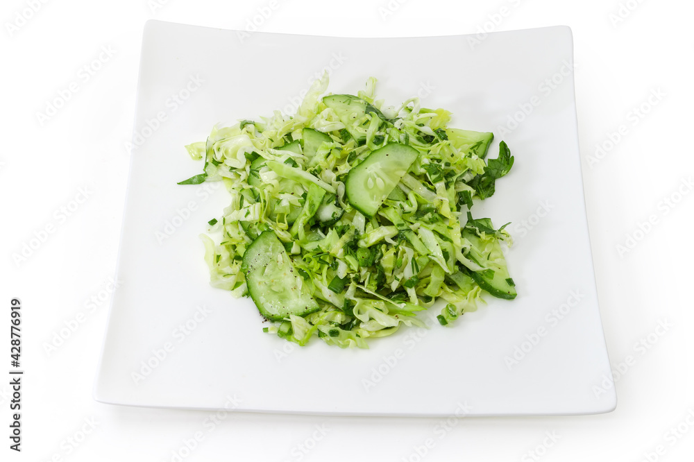 Green salad of sliced fresh vegetables on square dish Green salad of sliced fresh vegetables on square dish