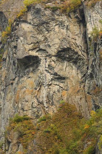 Old mountain with naturally emerged face