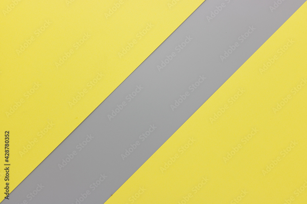Flat lay. Top view blank yellow and gray paper background with copy space. Trendy theme of color of the year 2021. Ultimate gray and Illuminating. Color paper background. 02 Flat lay. Top view blank yellow and gray paper background with copy space. Trendy theme of color of the year 2021. Ultimate gray and Illuminating. Color paper background. 02