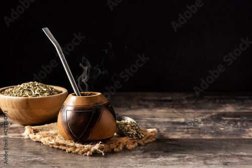 Traditional yerba mate tea on wooden table.Copy space