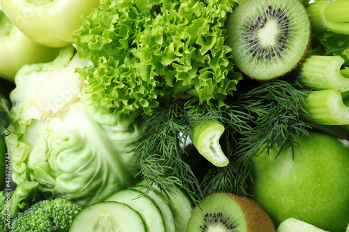 Принти на полотні Fresh green vegetables on whole background, close up
