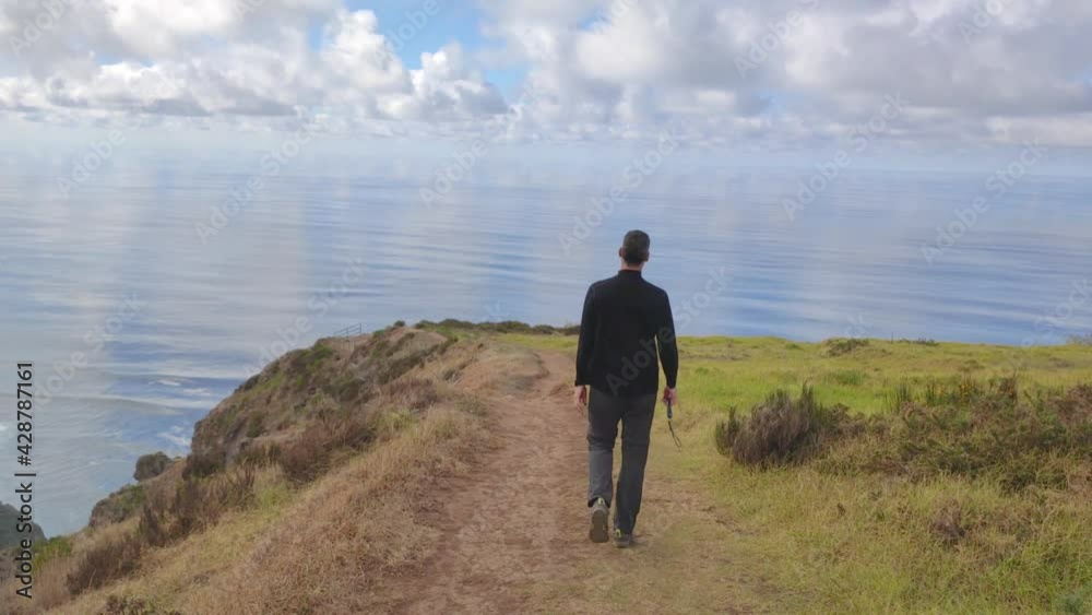 Man walking towards a beautiful viewpoint on island Madeira. Man walking towards a beautiful viewpoint on island Madeira.
