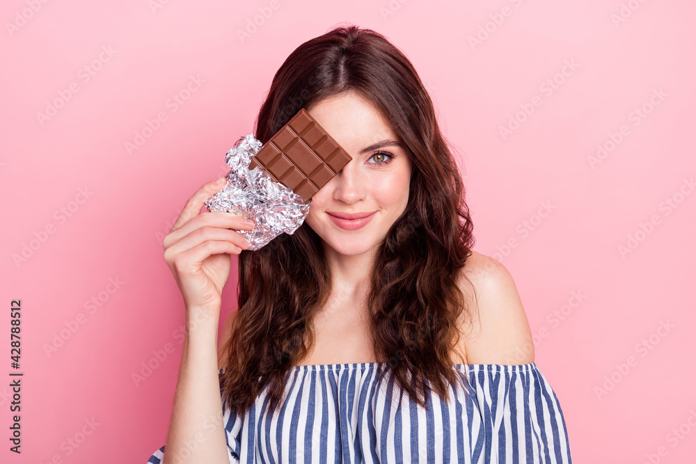 Photo of nice optimistic brunette lady hold chocolate cover face wear blue dress isolated on pink color background Photo of nice optimistic brunette lady hold chocolate cover face wear blue dress isolated on pink color background