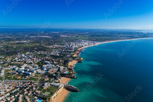 Aerial view of the scenic Algarve coastline, with beaches and resorts; Concept for summer vacations in Portugal