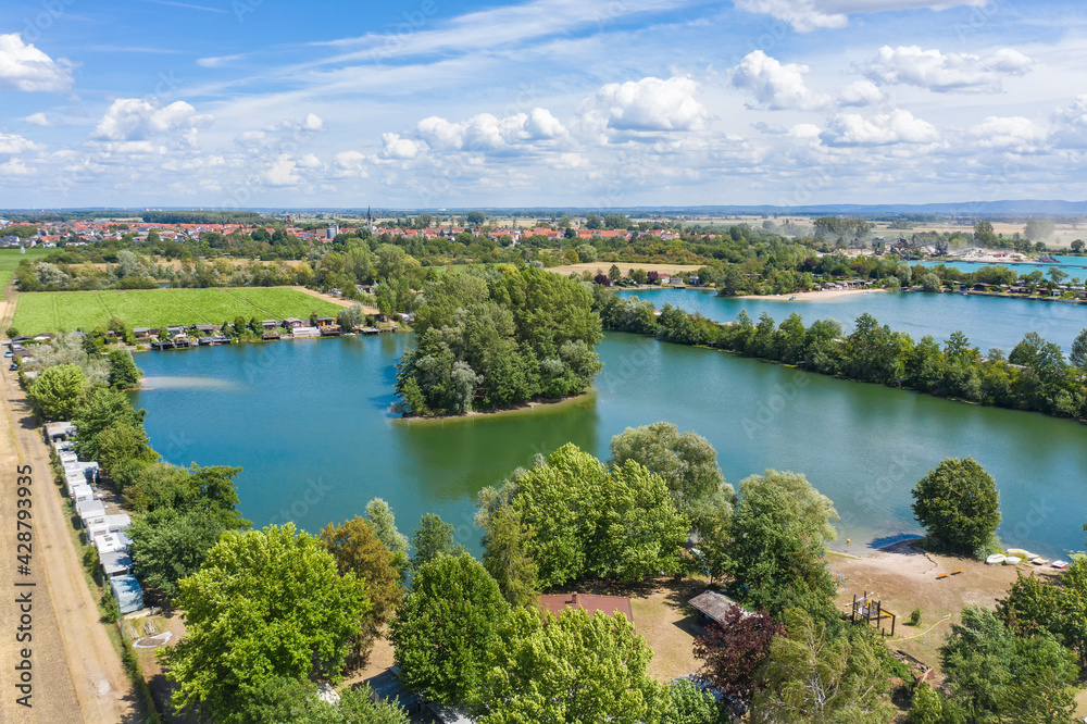 View from the bird's eye view of the quarry ponds in the Hessian Ried / Germany in wonderful sunshine 