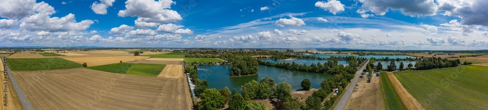 View from the bird's eye view of the quarry ponds in the Hessian Ried / Germany in wonderful sunshine 