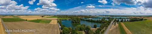View from the bird's eye view of the quarry ponds in the Hessian Ried / Germany in wonderful sunshine  © fotografci