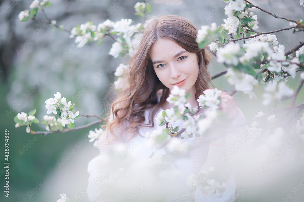 happy girl dreaming in a blooming garden, fresh tenderness spring woman in flowers happy girl dreaming in a blooming garden, fresh tenderness spring woman in flowers