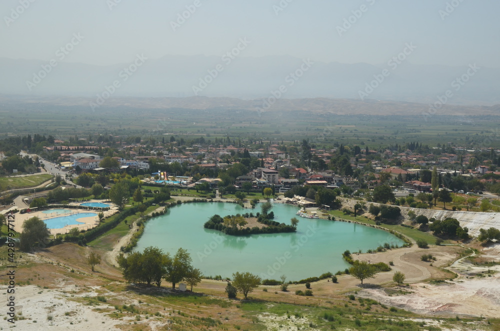 Landscape from to Natural travertine pools and terraces in Pamukkale. Cotton castle in southwestern Turkey. View to mountains landscape