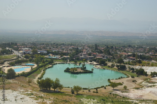 Landscape from to Natural travertine pools and terraces in Pamukkale. Cotton castle in southwestern Turkey. View to mountains landscape