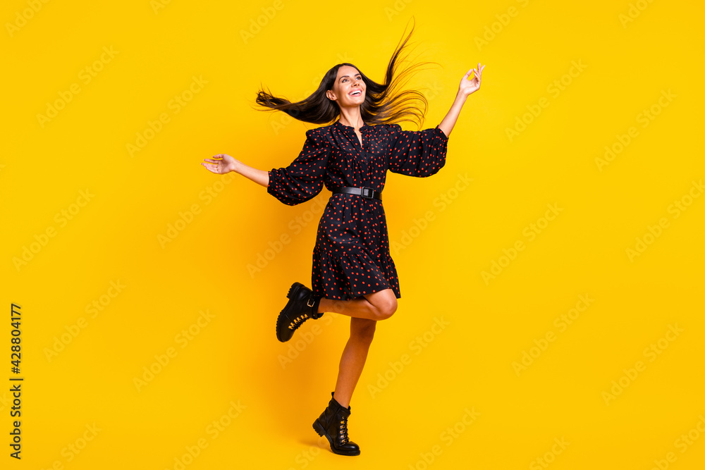 Full length body size view of attractive cheerful girl dancing having fun good mood isolated over bright yellow color background