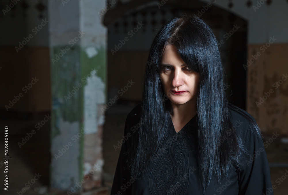 Fototapeta premium young goth woman in an abandoned building
