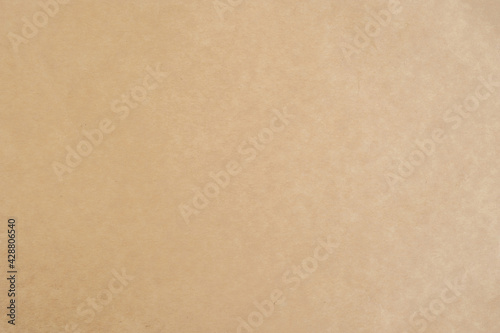 Aged texture of old vintage brown parchment paper, can be use as abstract background, wallpaper,  webpage, copy space for text. © tonstock