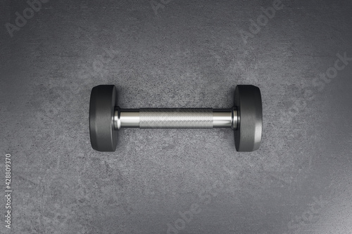 Sport and fitness concept with stylish black dumbbell on abstract dark surface background