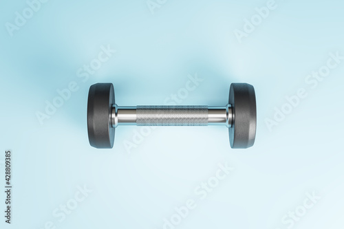 Sport and power concept with stylish black dumbbell in the center of light blue surface