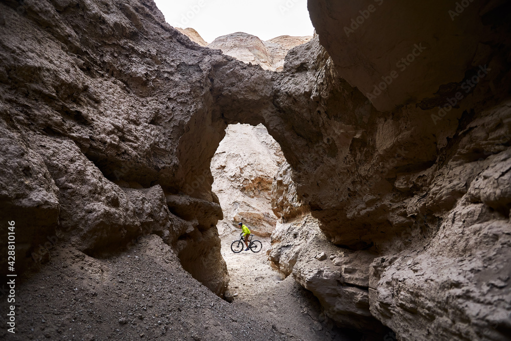 Mountain biker at the desert canyon