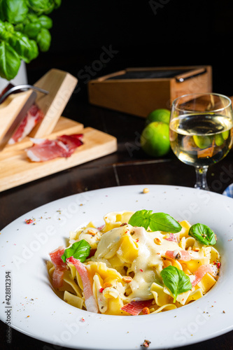 Tagliatelle with gorgonzola masarpone sauce and ham. photo