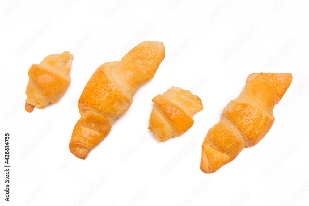 Fresh homemade cakes. Buns. Croissants isolated on white background Fresh homemade cakes. Buns. Croissants isolated on white background