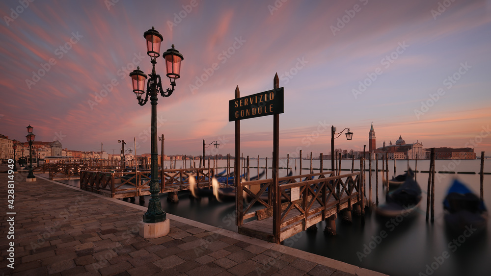 Piazza San Marco and waterfront promenade at sunset in Venice, Italy