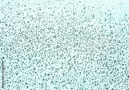 Rain drops on glass in rainy weather. Background.