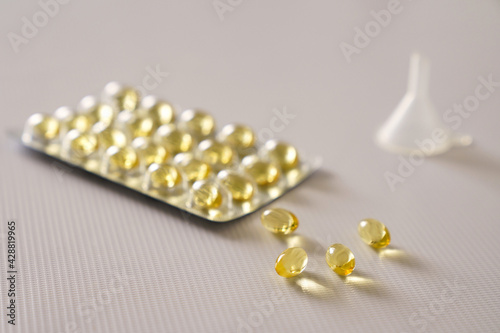 Omega 3 fish liver oil capsules in white background. Close up.