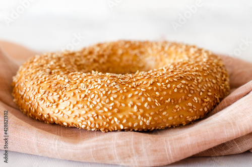 Turkish round bagel Simit with sesame seeds, a traditional Turkish bakery. Selective focus. Close-up.