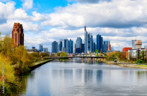 View of the Frankfurt skyline with the Main river and the Fl  sserbr  cke in the foreground