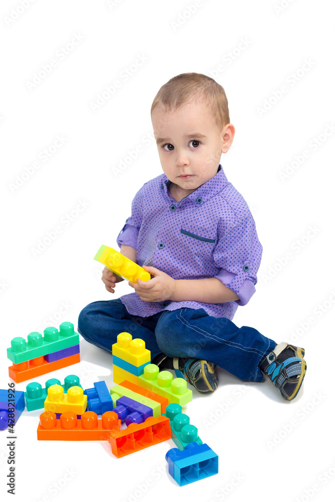 Boy playing with plastic toys white background isolated. Boy playing with plastic toys white background isolated.