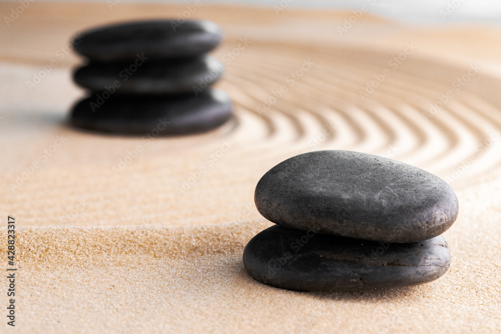 Japanese zen garden with stone in raked sand Japanese zen garden with stone in raked sand