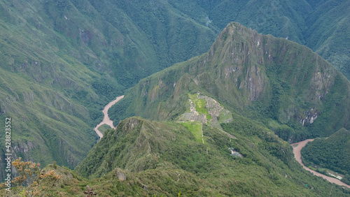 Aerial view of Machu Picchu ruins archaeological site and Wayna Picchu mountain in the background. Urubamba Province, Peru. One of the New Seven Wonders of the World, Unesco heritage. 
