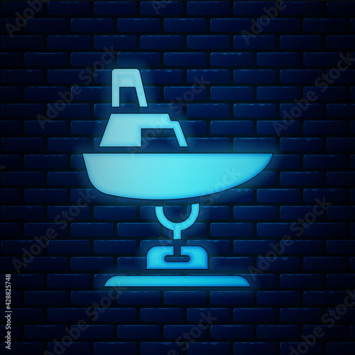 Glowing neon Swing boat on the playground icon isolated on brick wall background. Childrens carousel with boat. Amusement icon. Vector