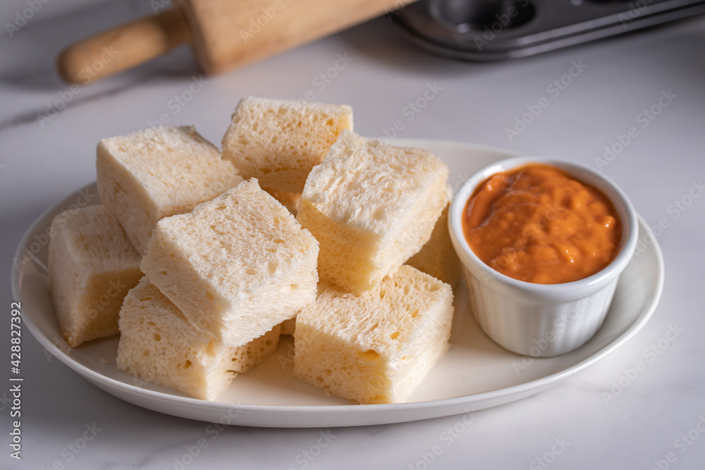 Steamed buns with Thai tea custard in white plate