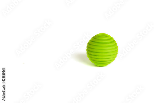 Children s toys. a green ball on a white background. A toy for babies and toddlers to joyfully learn mechanical skills