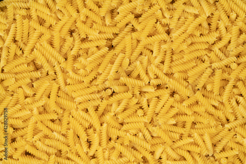 raw spiral pasta background texture