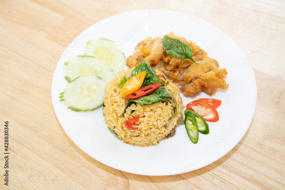 Green curry fried rice with fried chicken. Green curry fried rice with fried chicken.