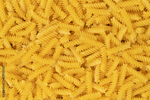 raw spiral pasta background texture