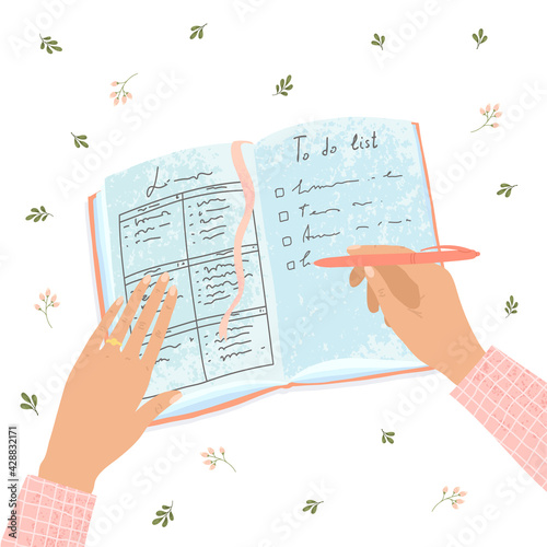 Illustration of the woman hand fills out a paper diary, makes plans