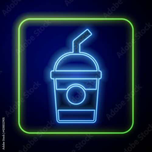 Glowing neon Milkshake icon isolated on blue background. Plastic cup with lid and straw. Vector