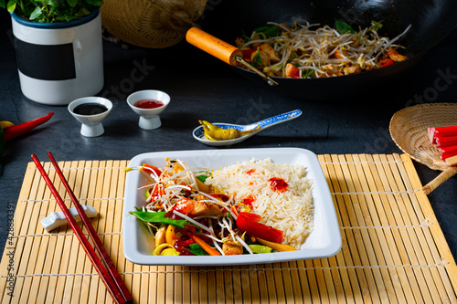 fried sweet and sour chicken with vegetables photo