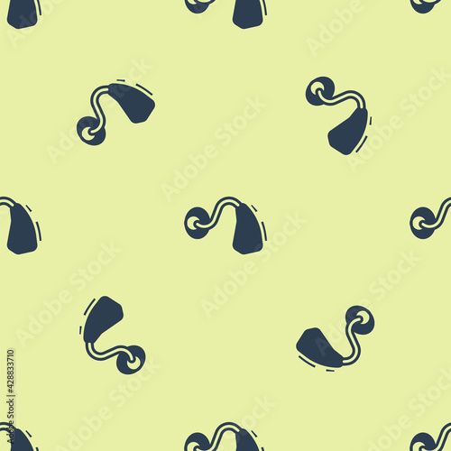 Blue Hearing aid icon isolated seamless pattern on yellow background. Hearing and ear. Vector