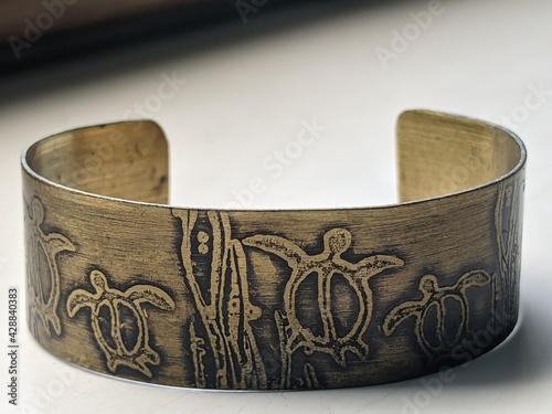 metal bracelet with turtle design