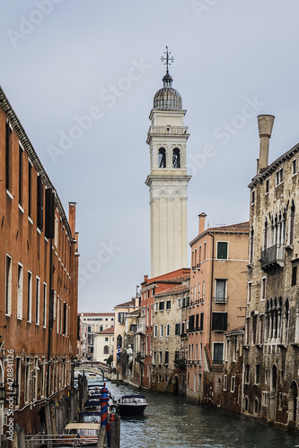 View of Rio dei Greci (Greeks' Canal) with the leaning bell tower of the orthodox church of San Giorgio dei Greci (1592) in the background. Venice, Veneto, Italy.