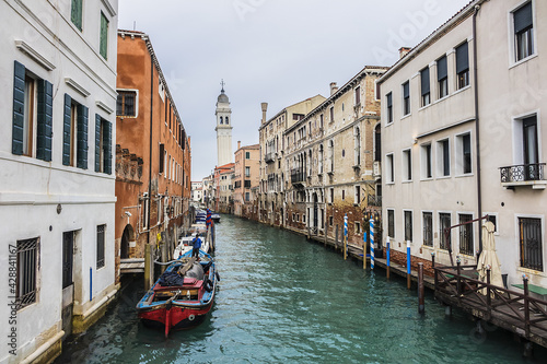 View of Rio dei Greci (Greeks' Canal) with the leaning bell tower of the orthodox church of San Giorgio dei Greci (1592) in the background. Venice, Veneto, Italy. © dbrnjhrj