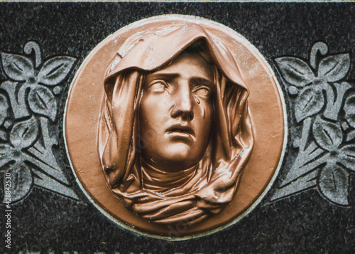 Stone sculpture crying face