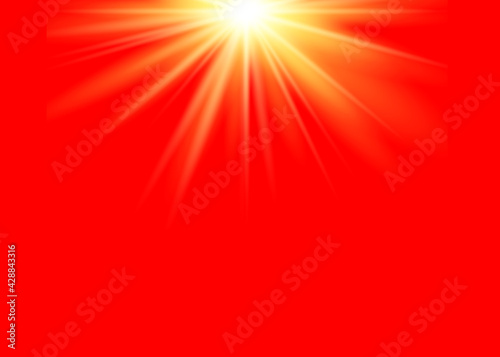 Rays of bright light on a red background.