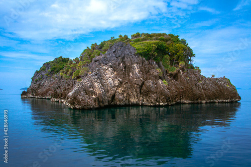 A beautiful and pristine small remote island view from the boat