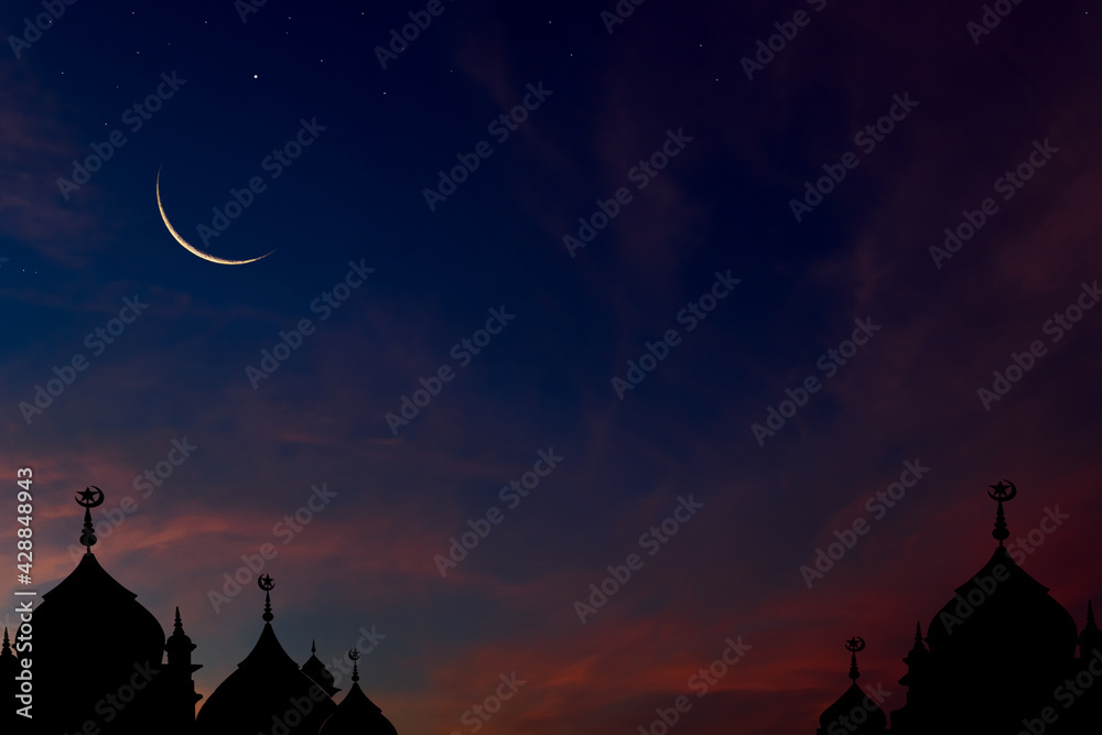 Crescent moon on dark blue dusk sky over mosques dome, well use text arabic on free space background 